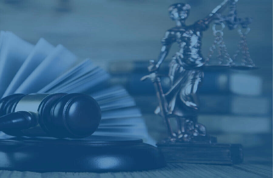 Judge's gavel, open law book and scales of justice
